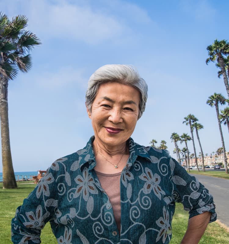 Woman in front of palm trees